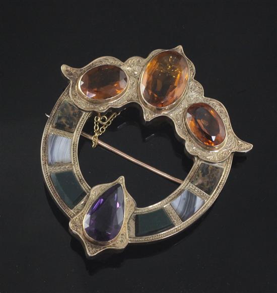 A late Victorian engraved gold, Scottish hardstone, amethyst and citrine set openwork brooch, 74mm.